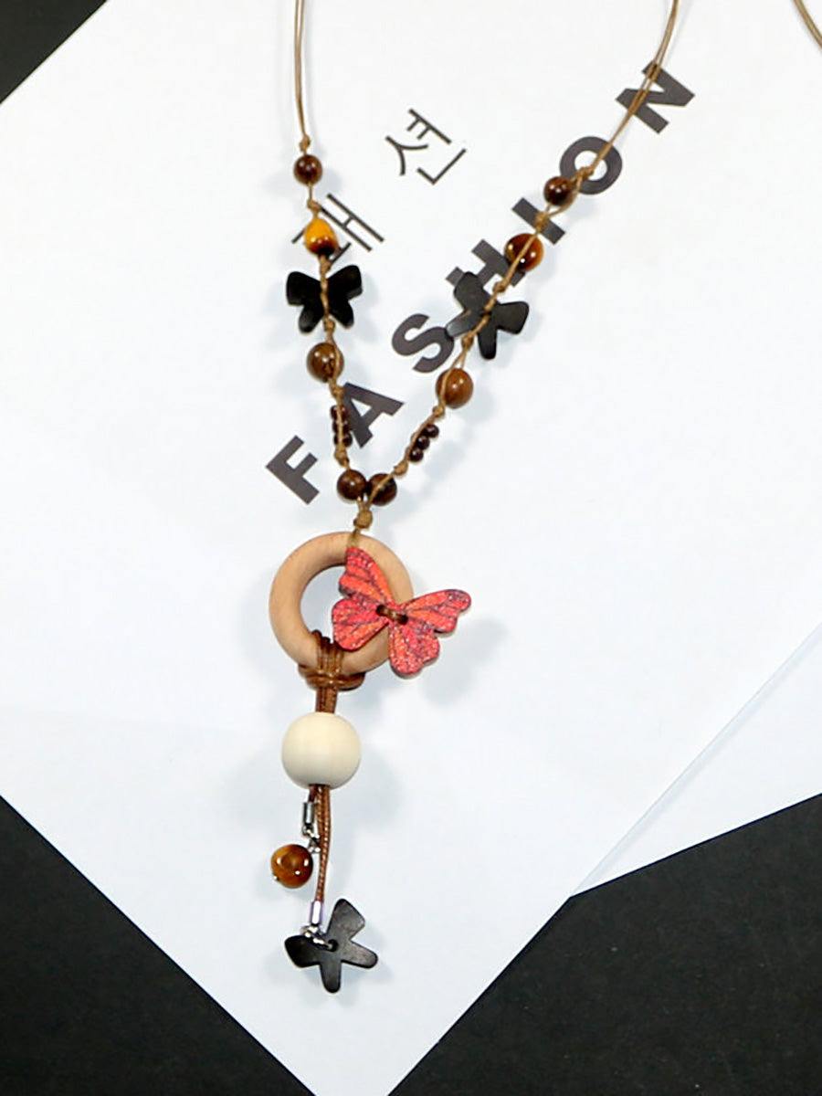 Collier femme en perles artistiques avec papillon en bois