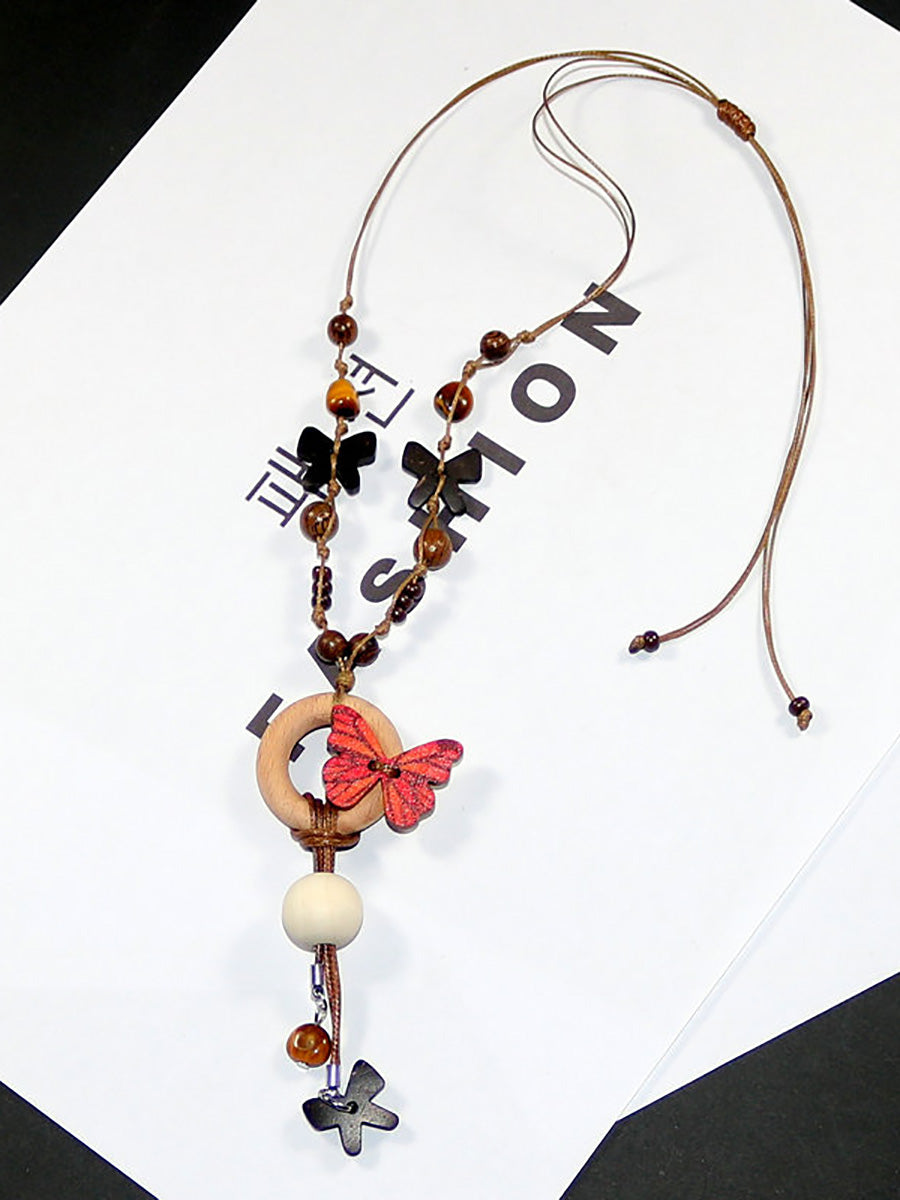 Collier femme en perles artistiques avec papillon en bois