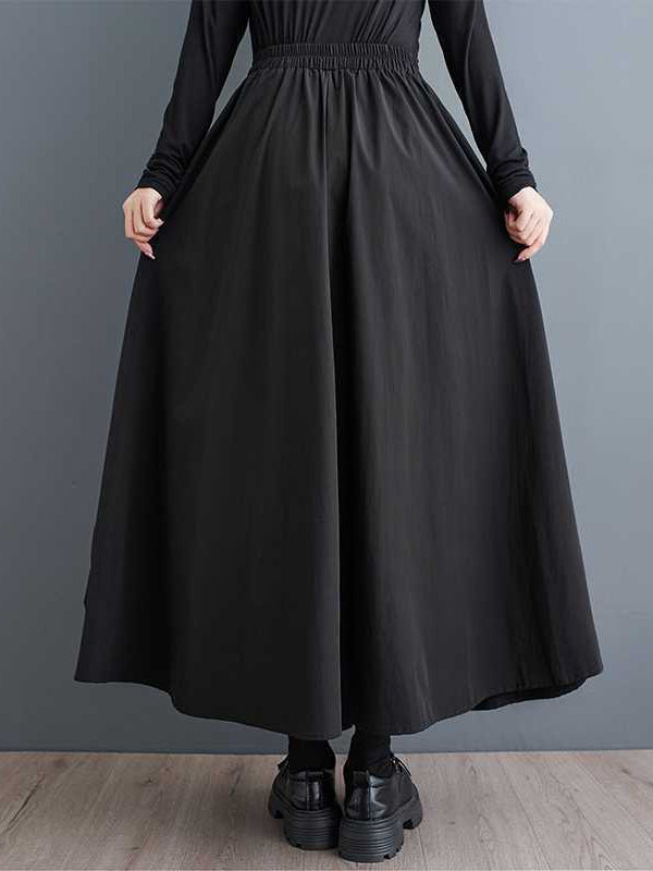 Jupe trapèze plissée noire à poches élastiques et fendue WS005