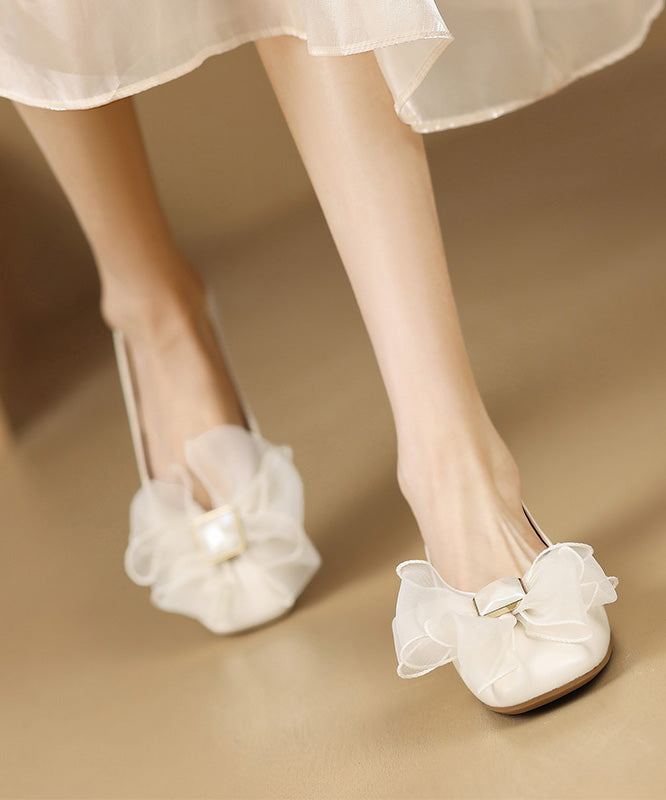 Französische Schaffell-Spleiß-Ballerinas mit Schleife in Beige