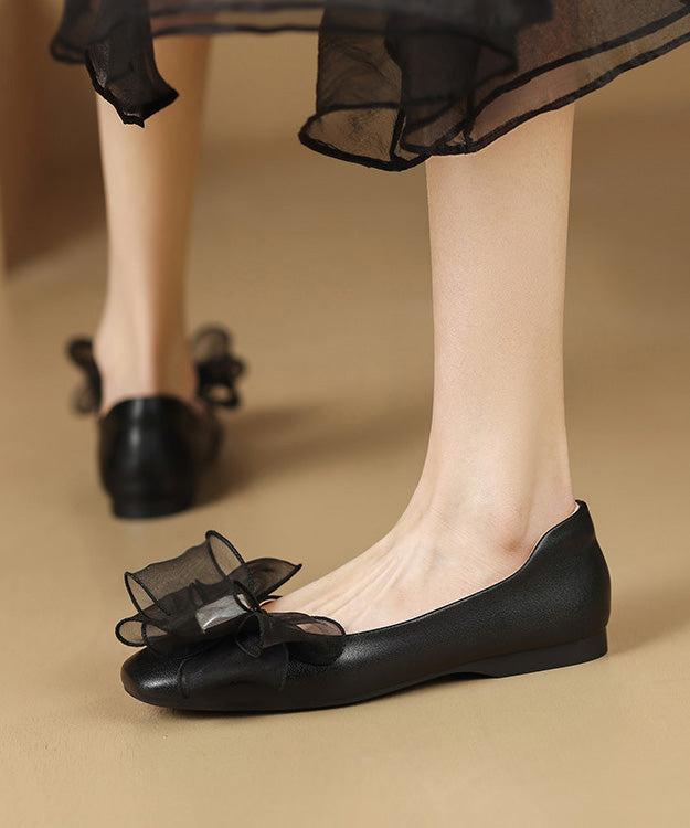 Französische Schaffell-Spleiß-Ballerinas mit Schleife in Beige