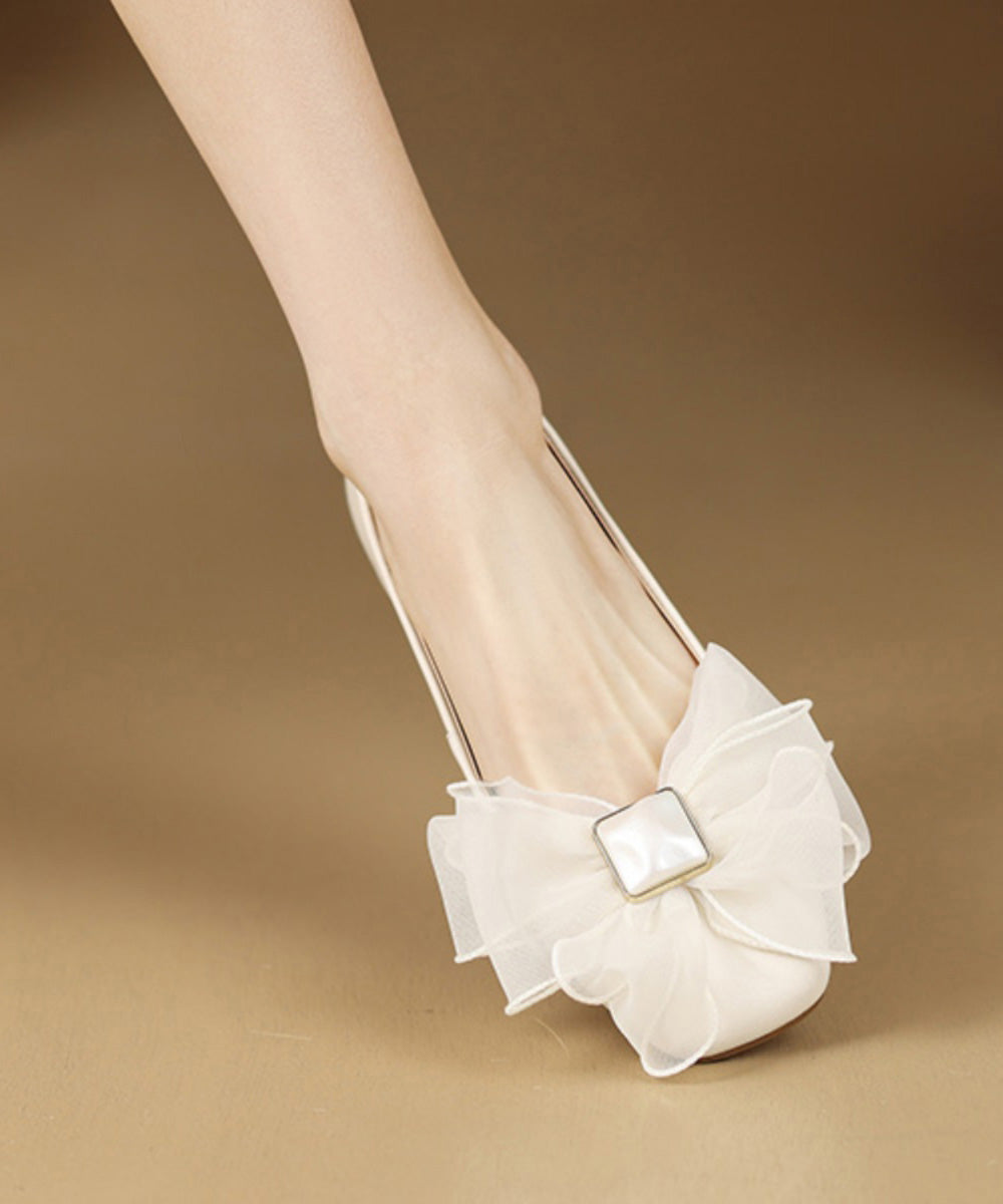 Französische Schaffell-Spleiß-Ballerinas mit Schleife in Beige