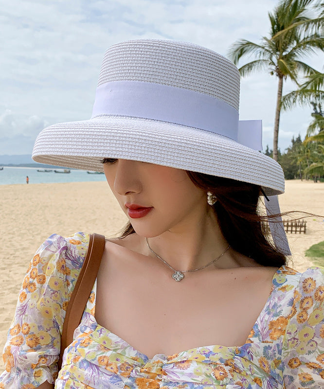 Chapeau de soleil de plage en paille tissée avec nœud noir Boutique II048