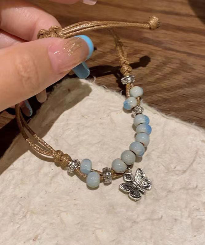 Ensemble de deux bracelets à breloques papillon en céramique tissée en alliage décontracté TX044