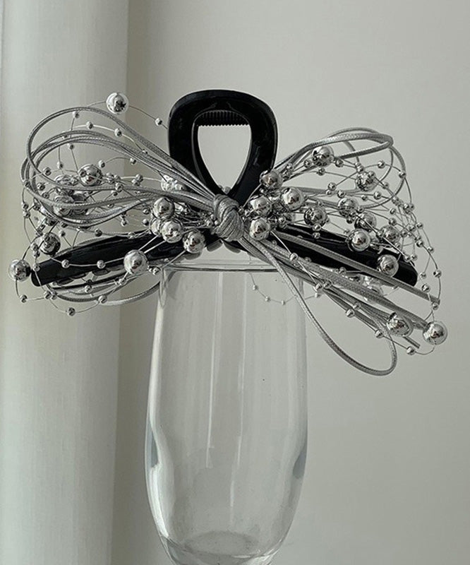 Épingle à cheveux chic en acrylique noir avec perles rondes et nœud RA011