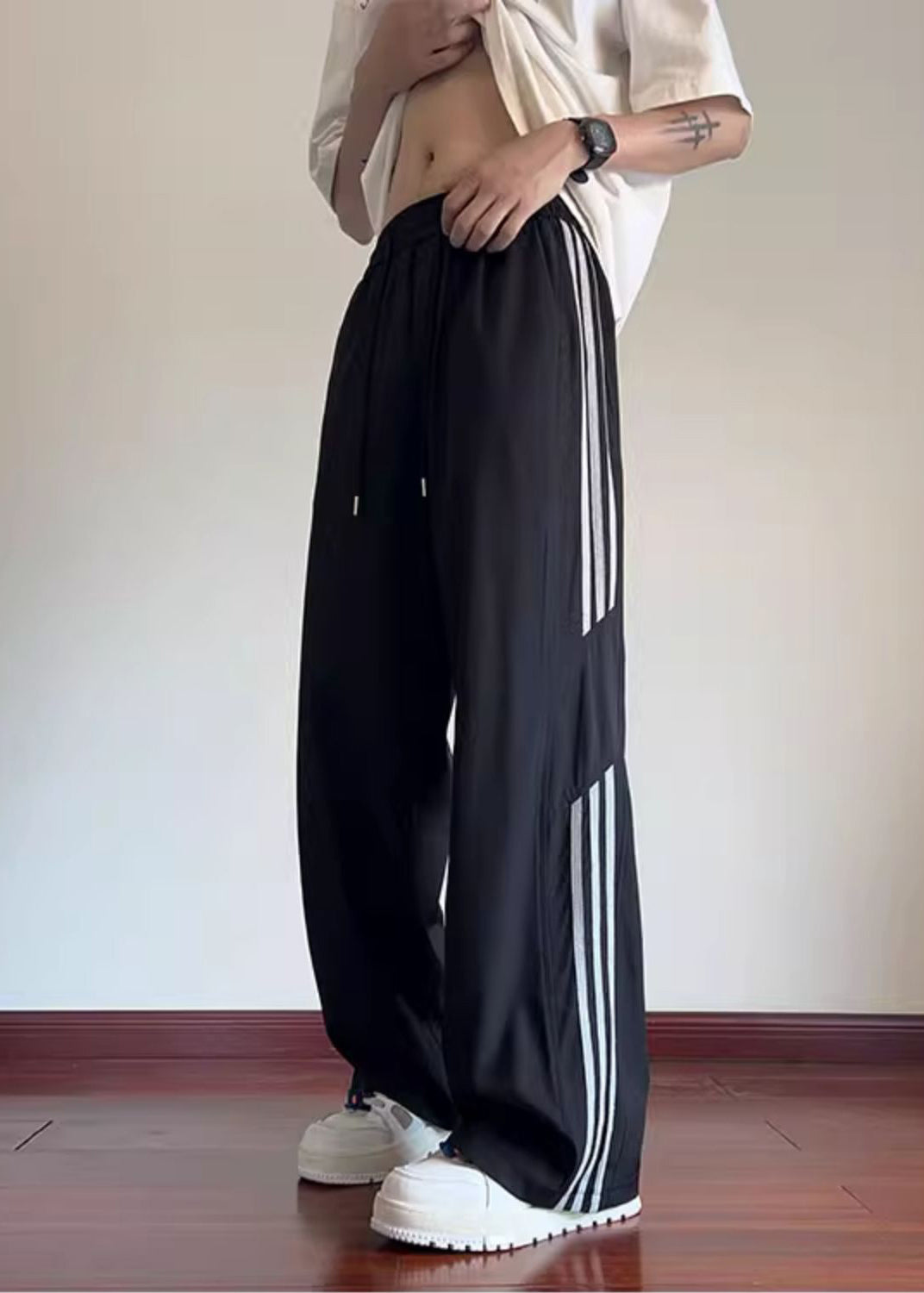 Pantalon noir élégant de printemps surdimensionné en coton rayé pour homme