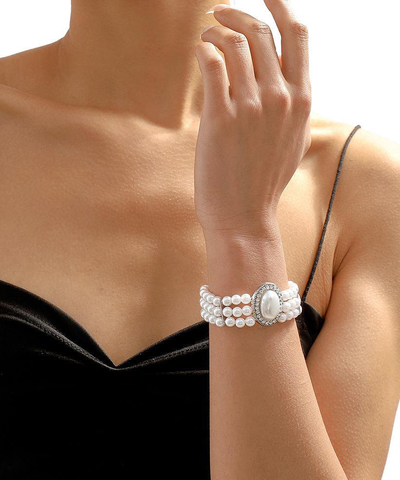 Bracelet élégant en alliage de cuivre doré, perle, zircon et résine à pampilles YI001