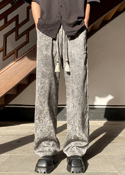 Pantalon gris en soie avec poches et taille large et élastique pour homme