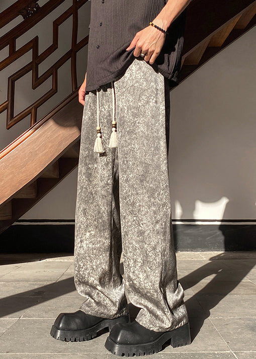 Pantalon gris en soie avec poches et taille large et élastique pour homme