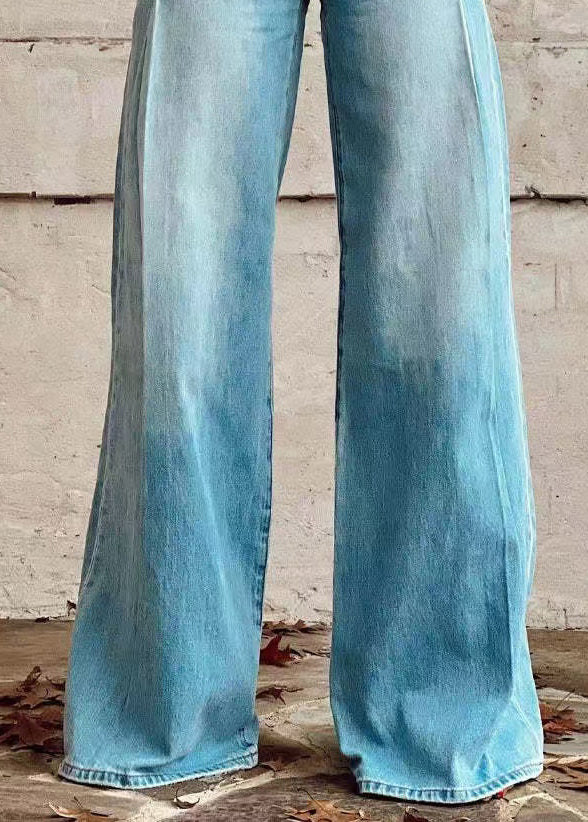 Pantalon ample taille haute en denim bleu avec poches à boutons légers