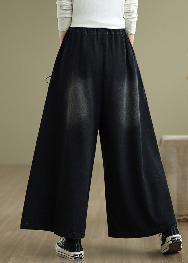 Pantalon noir à larges bretelles croisées en denim moderne pour l'été