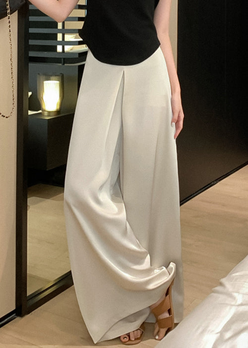 Pantalon beige taille haute en soie, fin et neuf, pour l'été