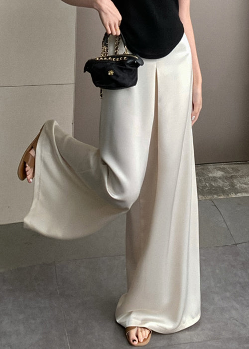 Pantalon beige taille haute en soie, fin et neuf, pour l'été