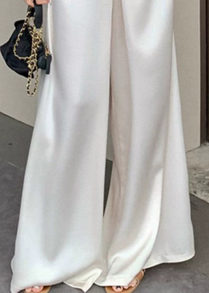 Pantalon beige taille haute en soie, fin et neuf, pour l'été