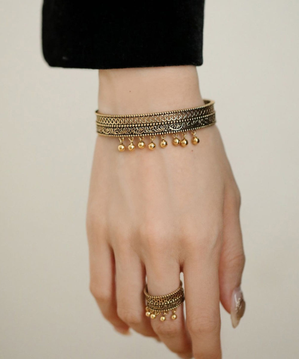 Retro Gold Alte Dharma Gold Quaste Patchwork Aushöhlen Armreif QU025