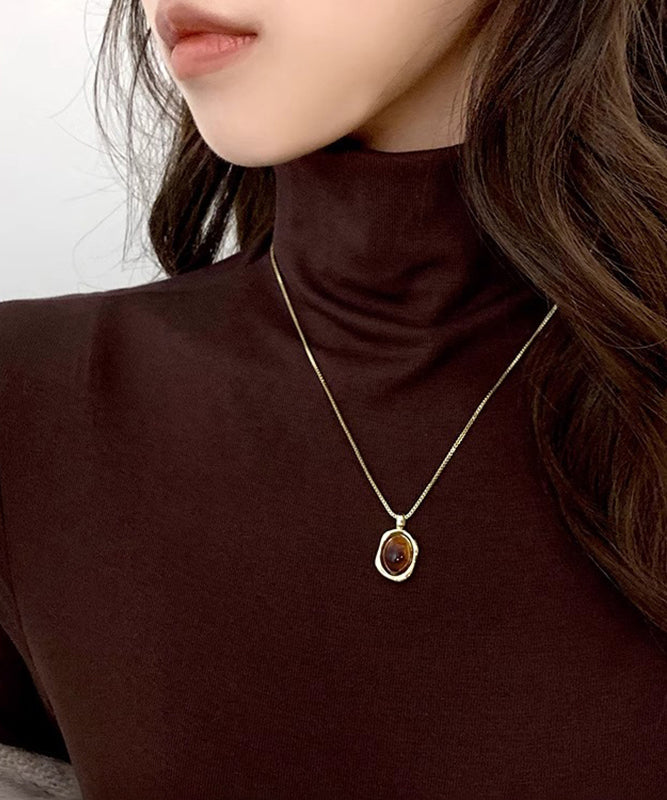 Ensemble de colliers et pendentifs en cuivre, ambre et or, style surdoré