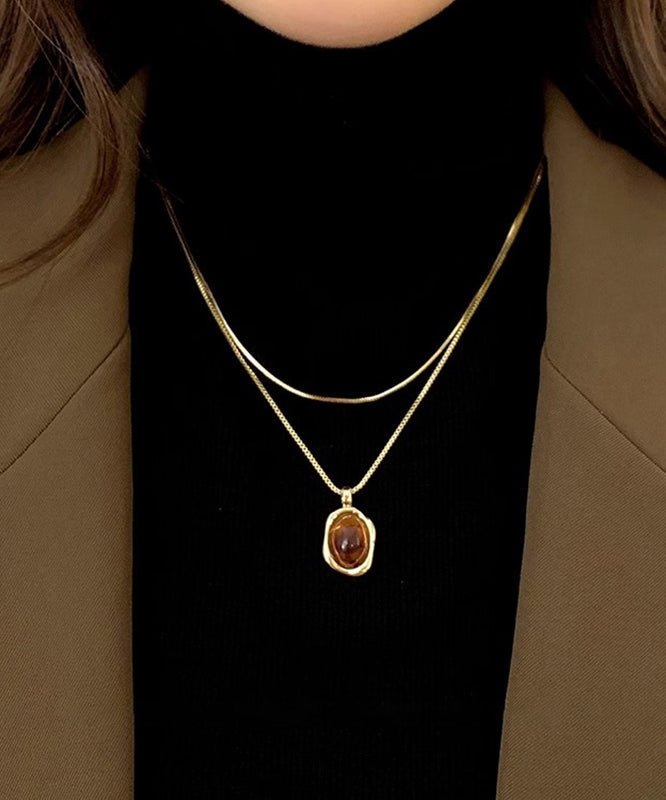 Ensemble de colliers et pendentifs en cuivre, ambre et or, style surdoré