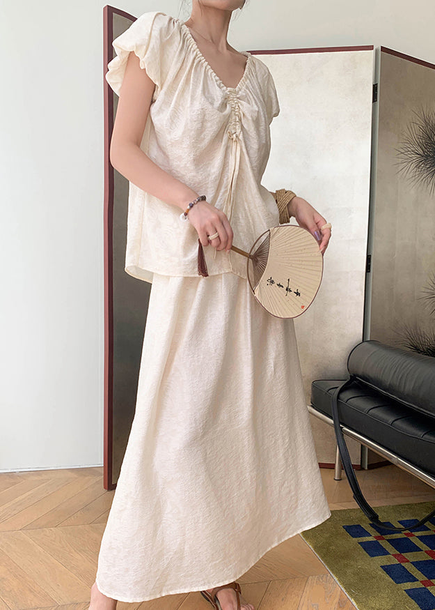 Ensemble deux pièces chic beige avec t-shirts cintrés à col montant et jupe longue en soie pour l'été AN1009