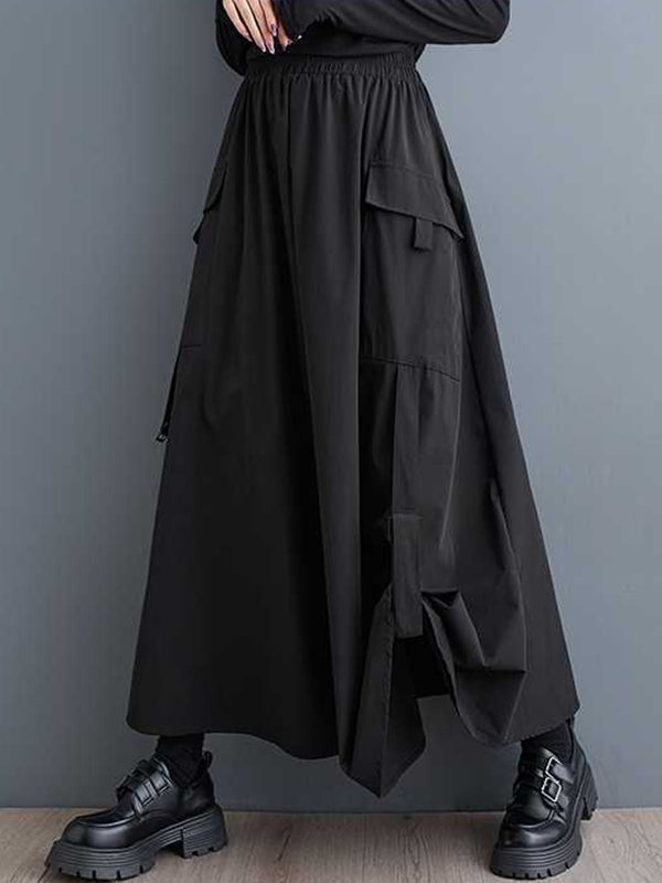 Jupe trapèze plissée noire à poches élastiques et fendue WS005