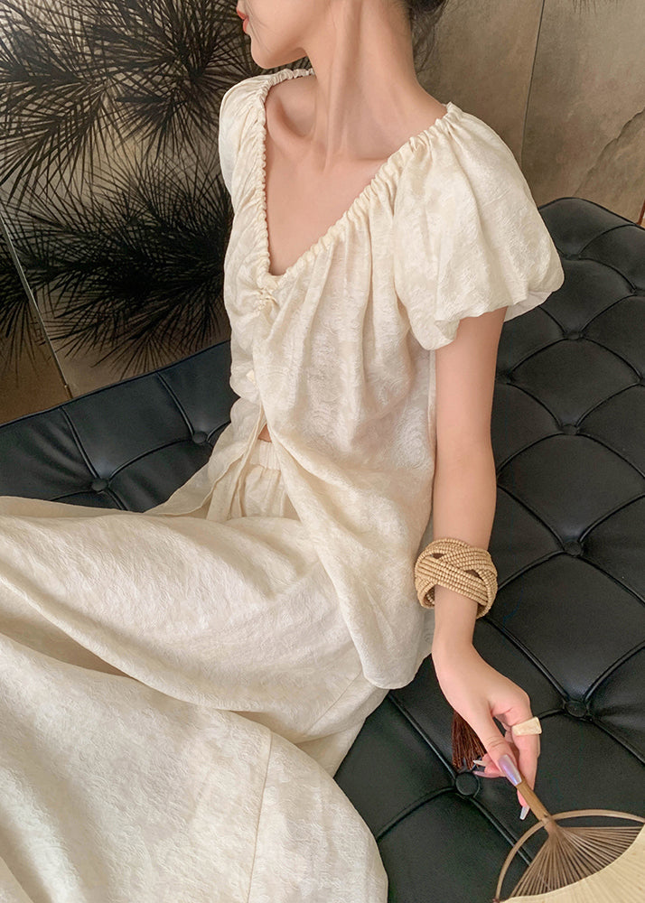 Ensemble deux pièces chic beige avec t-shirts cintrés à col montant et jupe longue en soie pour l'été AN1009