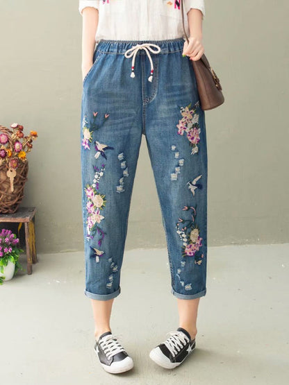 Pantalon sarouel décontracté d'été en denim avec broderie florale pour femme IO1022