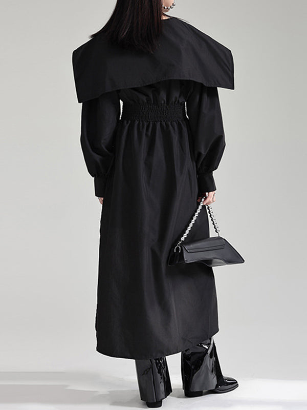 Robe longue noire plissée asymétrique à revers et ceinture moderne 