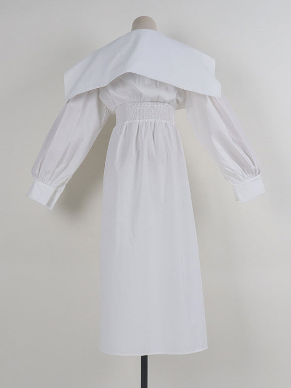 Robe longue noire plissée asymétrique à revers et ceinture moderne 