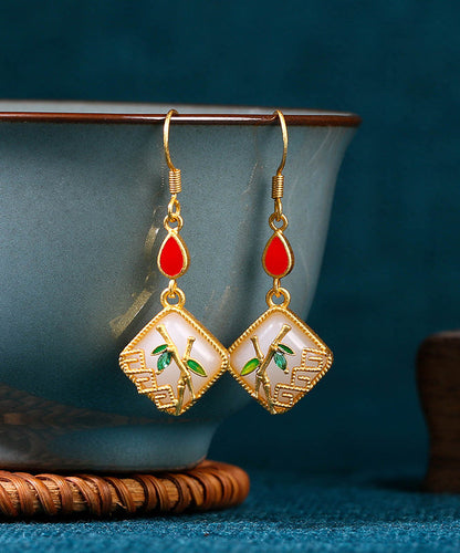 Boucles d'oreilles pendantes en forme de feuille de bambou avec pierres précieuses en jade et cuivre doré KX1090