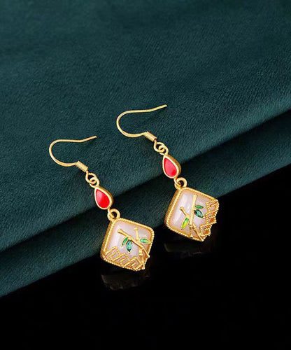 Boucles d'oreilles pendantes en forme de feuille de bambou avec pierres précieuses en jade et cuivre doré KX1090