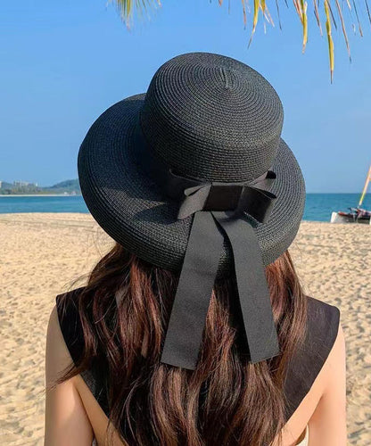 Chapeau de soleil de plage en paille tissée avec nœud noir Boutique II048