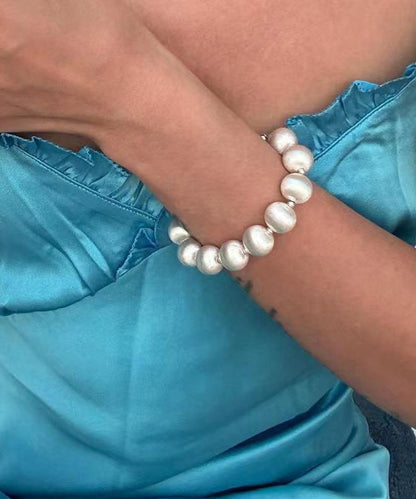 Bracelet chic en acier inoxydable blanc avec chaîne en perles brossées en soie WO007