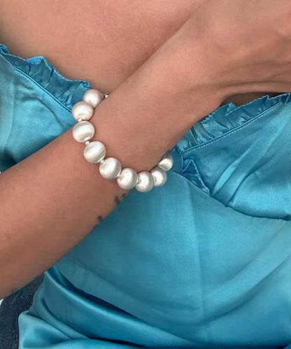 Bracelet chic en acier inoxydable blanc avec chaîne en perles brossées en soie WO007