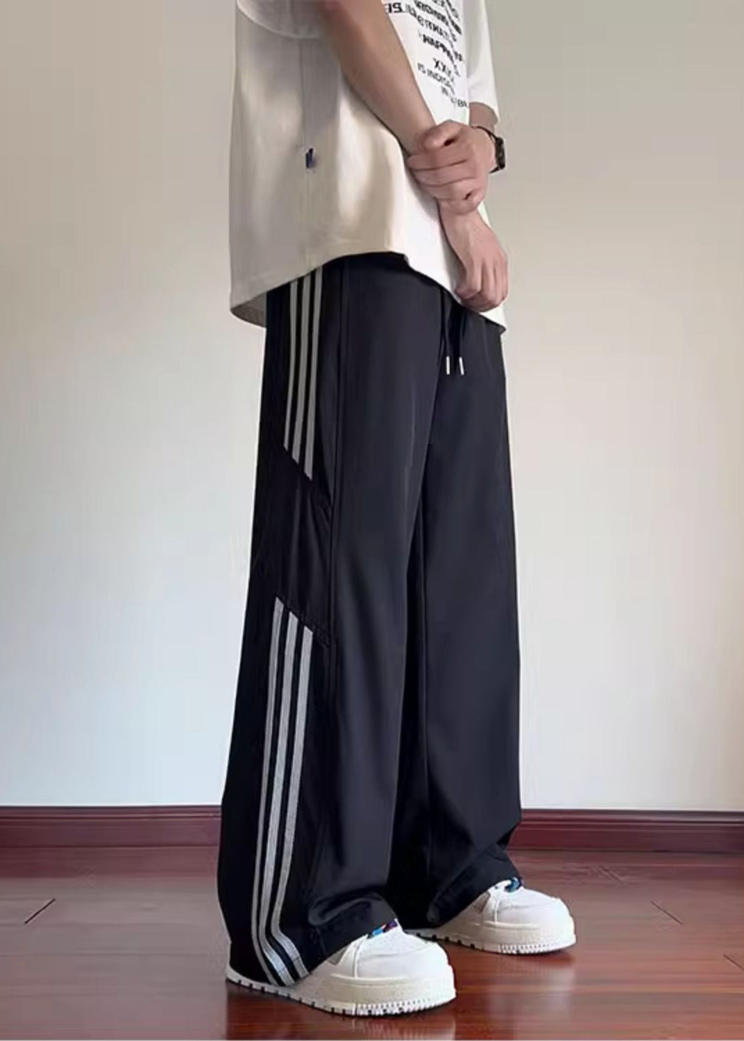 Pantalon noir élégant de printemps surdimensionné en coton rayé pour homme