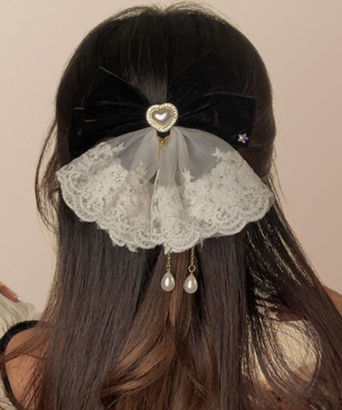 Épingle à cheveux en alliage de cristal avec pompon et nœud rouge élégant