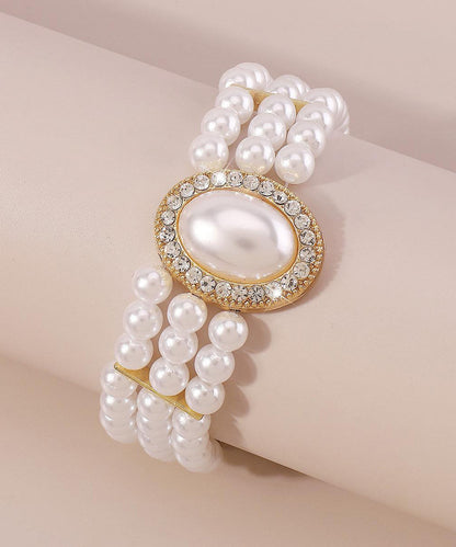 Bracelet élégant en alliage de cuivre doré, perle, zircon et résine à pampilles YI001