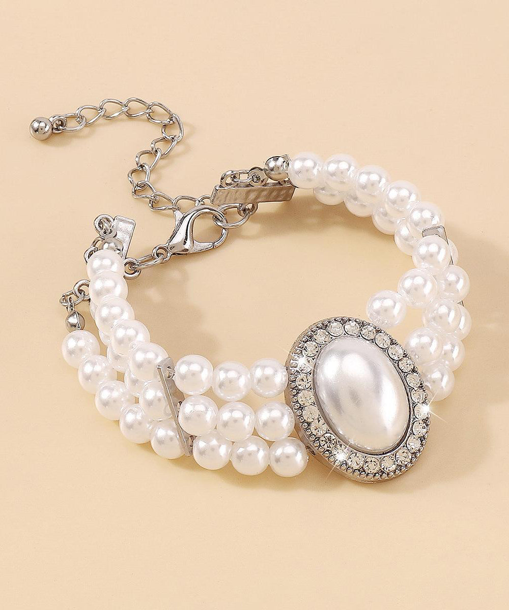 Bracelet élégant en alliage de cuivre doré, perle, zircon et résine à pampilles YI001