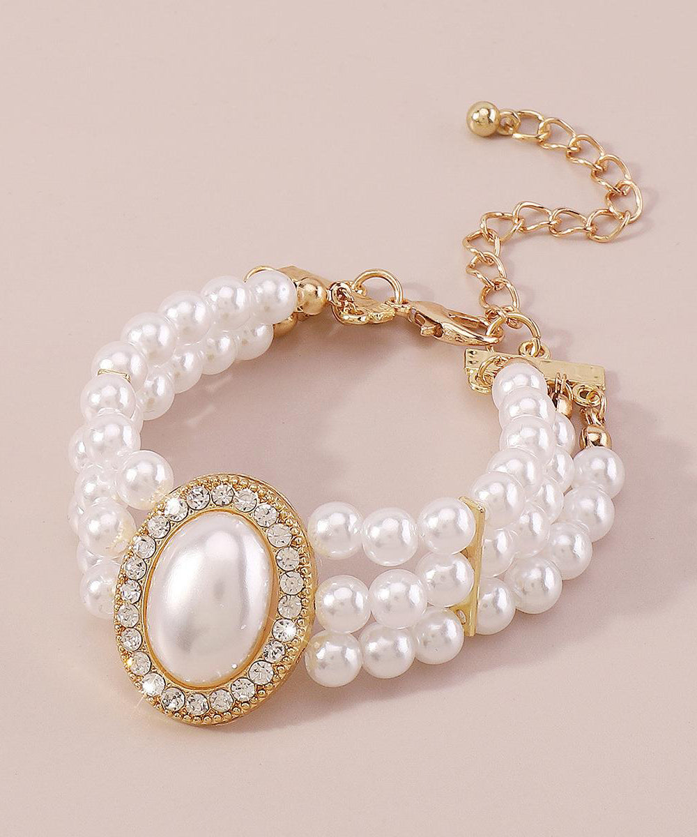 Bracelet élégant en alliage de cuivre doré, perle, zircon et résine à pampilles YI001