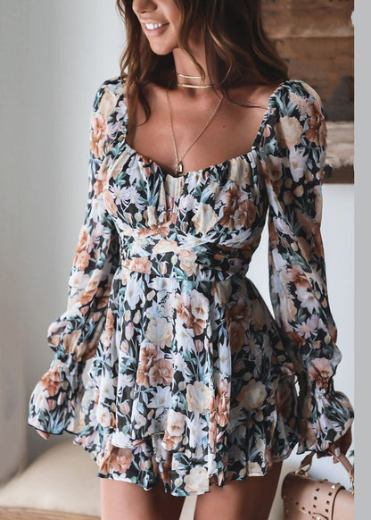 Combinaison rose élégante à imprimé printanier et fermeture éclair avec dentelle