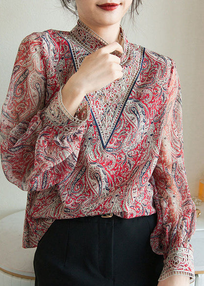 Chemise en mousseline de soie bleue à imprimé brodé et manches lanternes TZ039