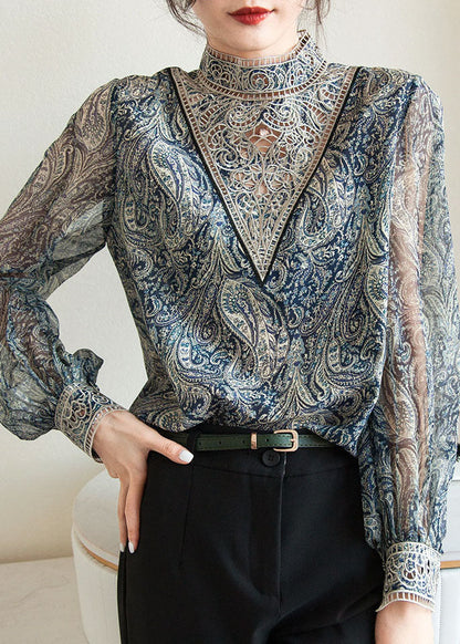 Chemise en mousseline de soie bleue à imprimé brodé et manches lanternes TZ039