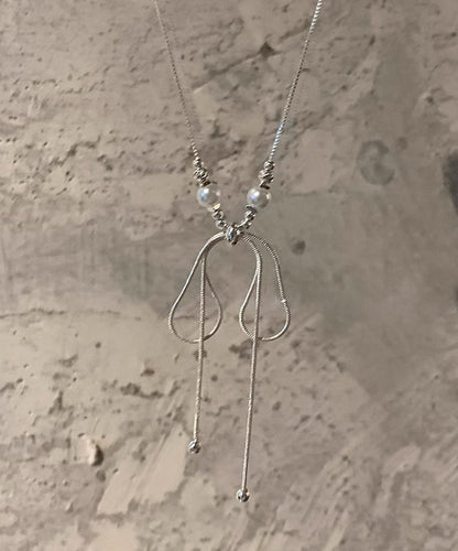 Collier avec pendentif en forme de nœud en alliage de soie fine et perles YU002