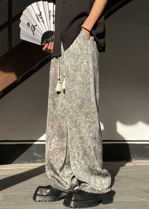 Pantalon gris en soie avec poches et taille large et élastique pour homme