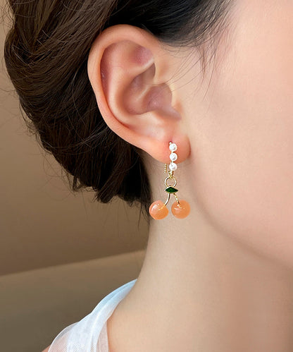 Boucles d'oreilles créoles fantaisie en alliage de cuivre orange et perles de cerisier WH040