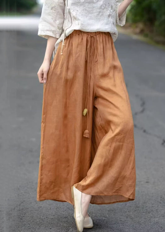 Pantalon court en coton élastique uni orange avec poches et taille haute pour l'été