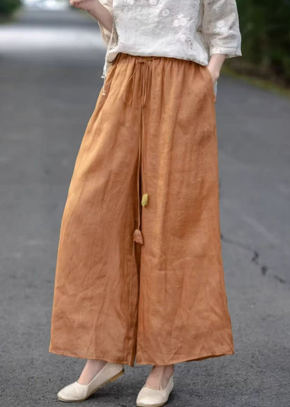 Pantalon court en coton élastique uni orange avec poches et taille haute pour l'été