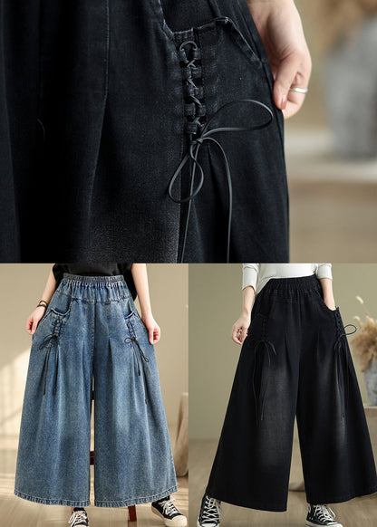 Pantalon d'été à bretelles larges et froissées en denim bleu à jambes croisées 