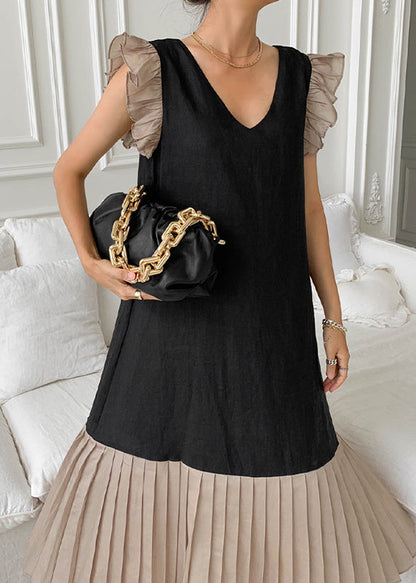 Patchworkkleid mit plissierten Baumwollärmeln und schwarzem Schmetterling 