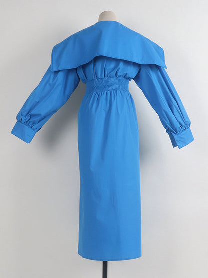 Robe longue noire plissée asymétrique à revers et ceinture moderne 